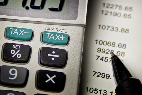 Calculating Taxes Up And Down by kenteegardin rich poor photo