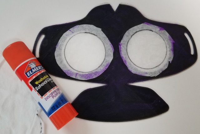 Apply glue to backside of mask